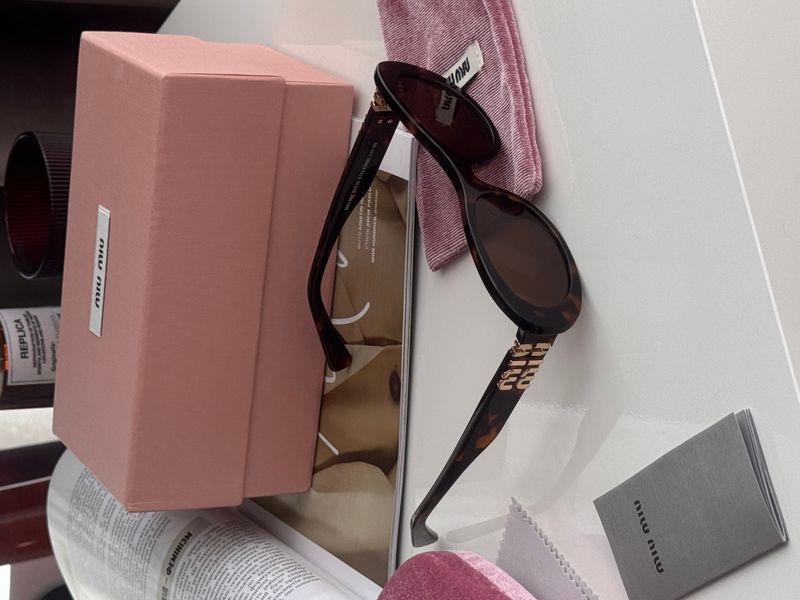 Очки Miu Miu SMU 06Z E142-F05S0 3N Leo/Gold 0322 фото